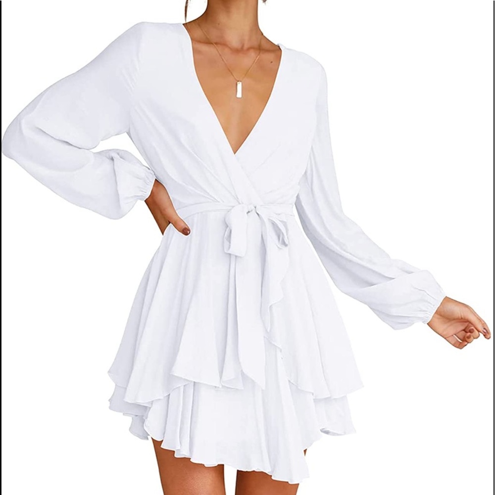 Beautiful white flowy short dress. Great to dress up or down.